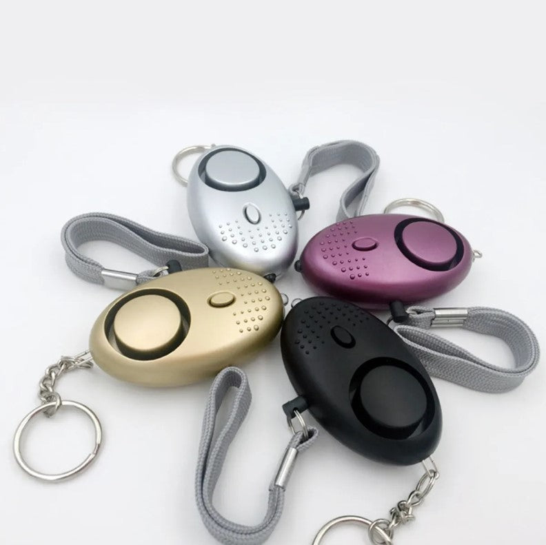 Llavero De Defensa Personal Alarma Panico Sirena Linterna